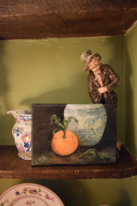 Still life with a tangerine and a Chinese jar